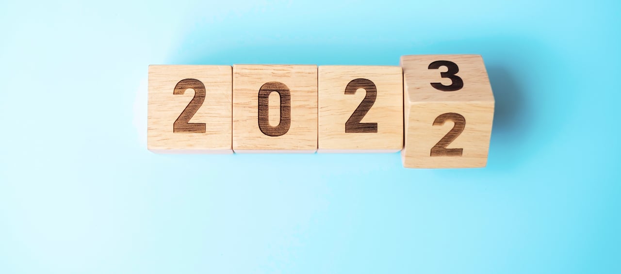 Year 2022 to 2023 in wooden blocks with blue background